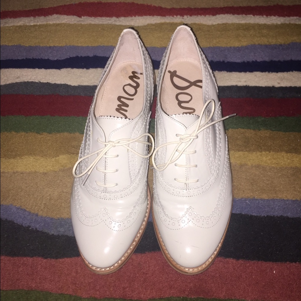 Women's Sam Edelman white wingtip flat oxfords.